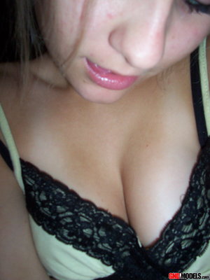 1 dark haired female tortures another during lezdom play in concrete cellar